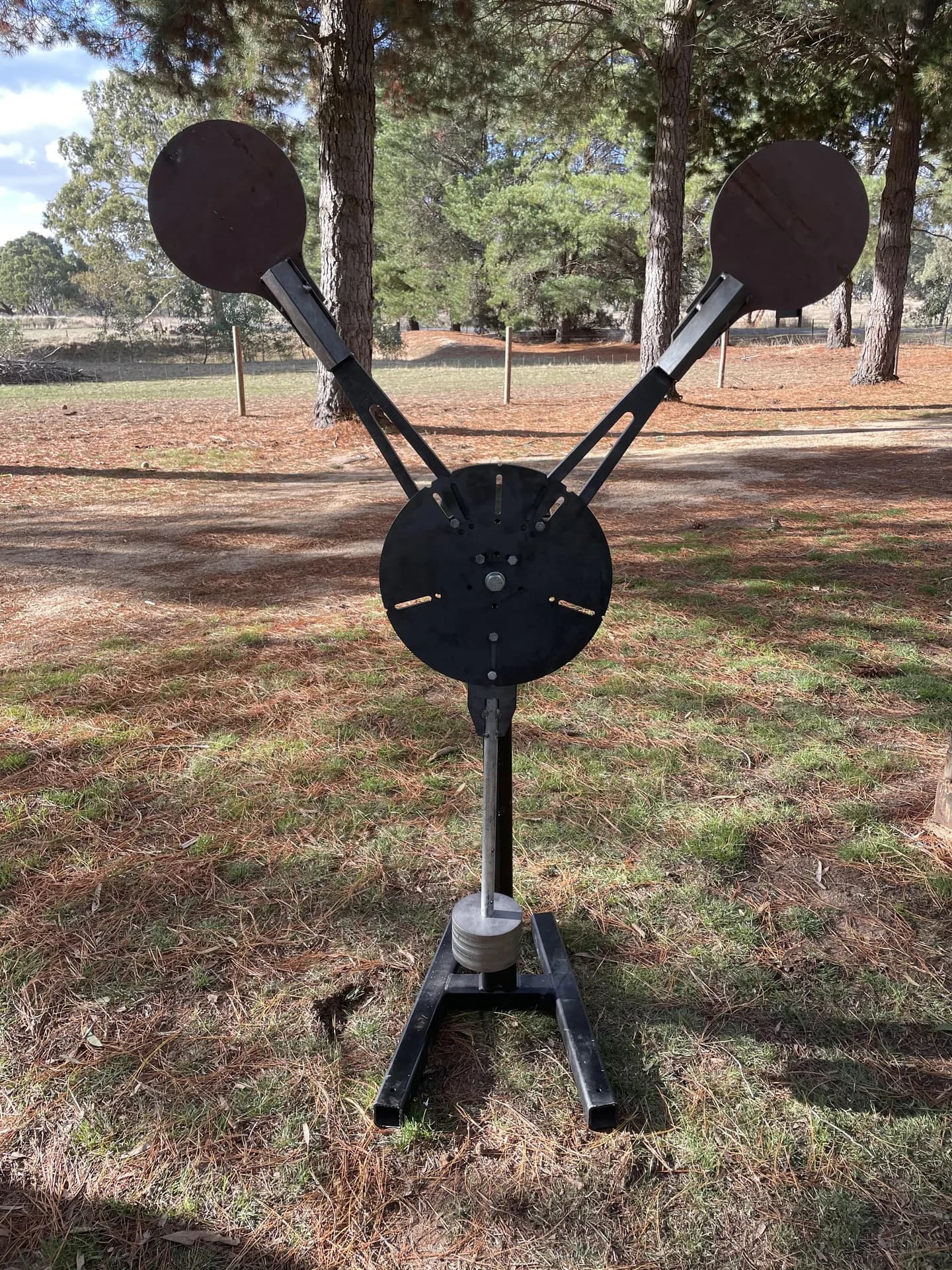 A Lorco reactive steel target system with circular plates and a fabricated stand.